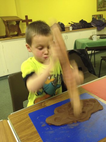 James battering the clay into a labyrinth